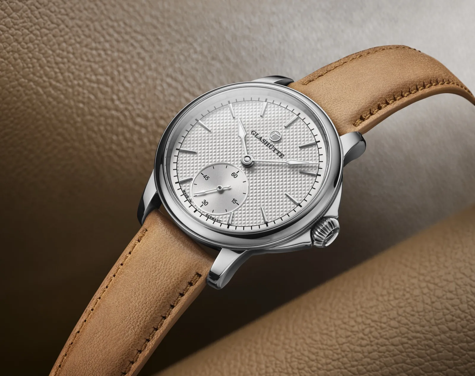 Patria — silver guilloché dial on caramel leather