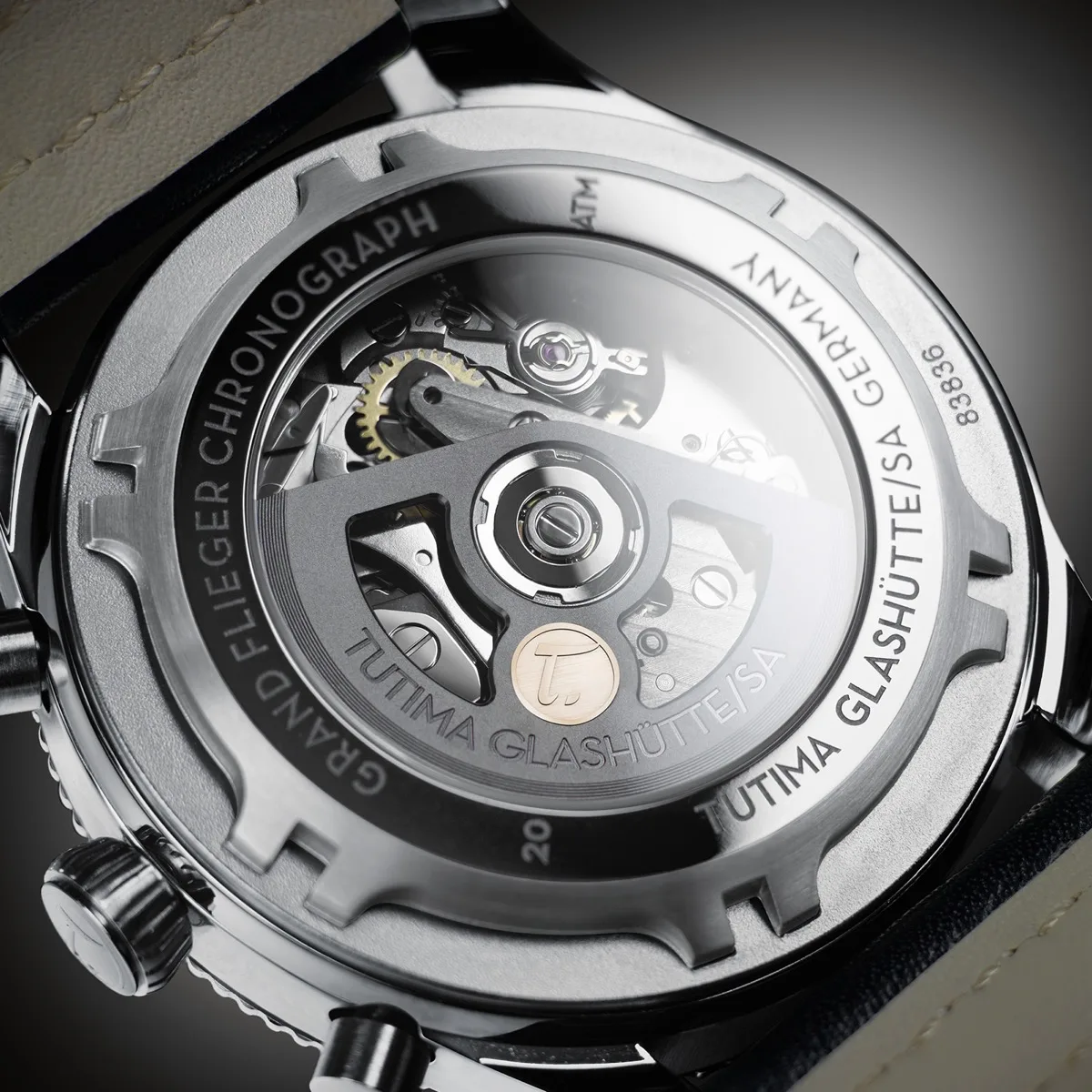 Caliber 320 automatic chronograph — Grand Flieger caseback with 18K gold rotor seal