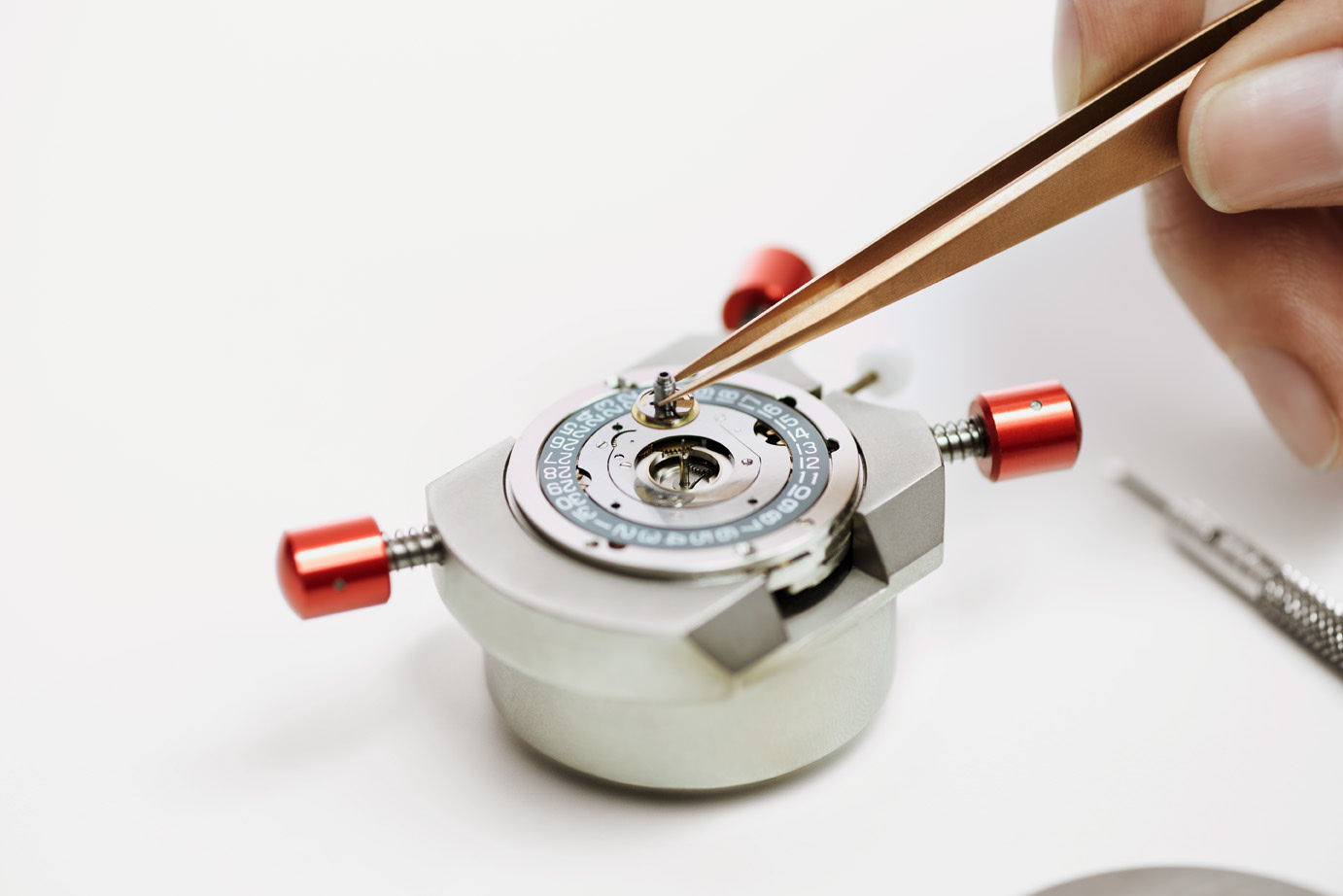 Caliber 617 assembly — tweezers placing a component