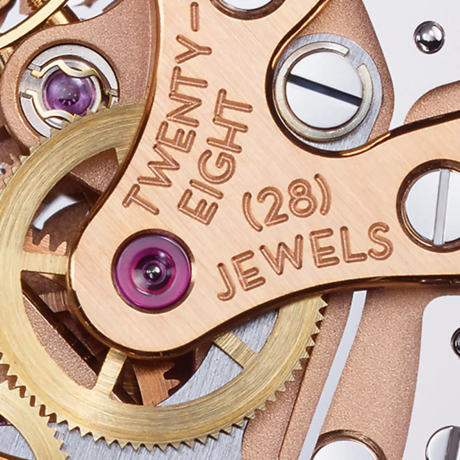 Caliber T659 — Twenty-Eight (28) Jewels engraving close-up, jewel bearing on rose gold bridge