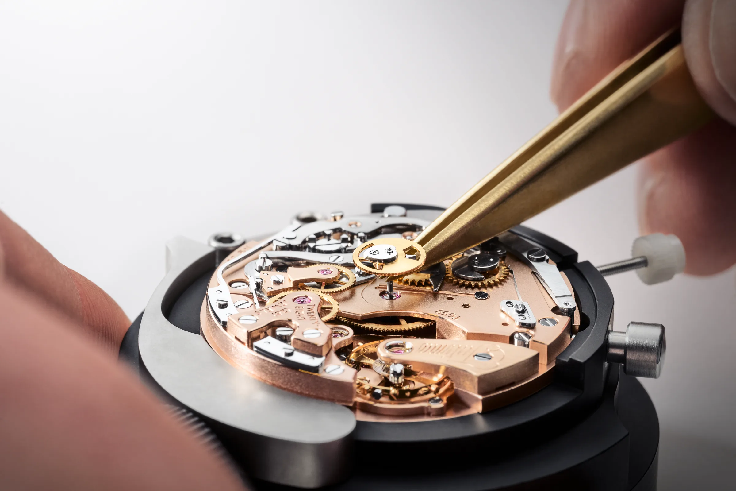 Assembling a Tutima manufacture movement with brass tweezers in Glashütte