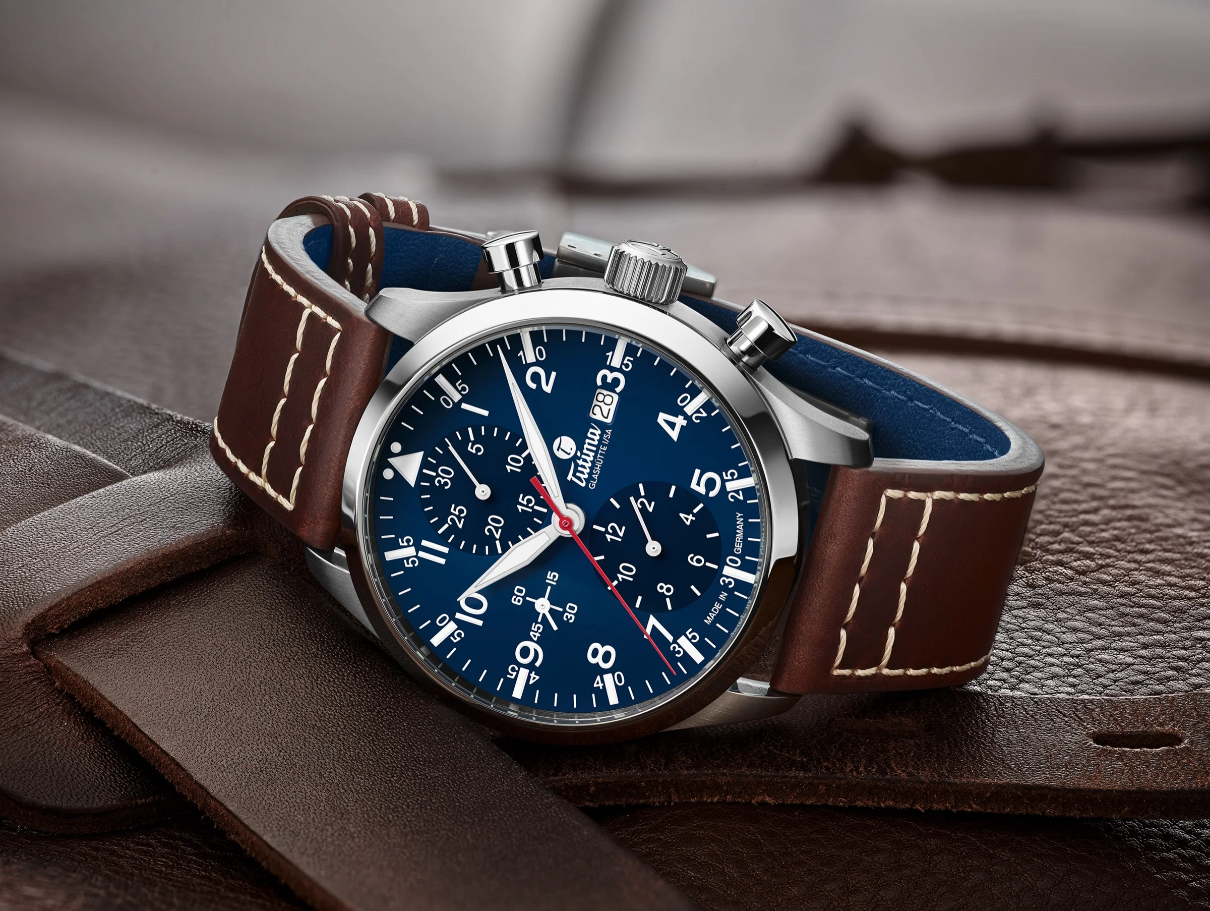 Flieger Legacy T5 — blue dial on brown leather, aviation heritage
