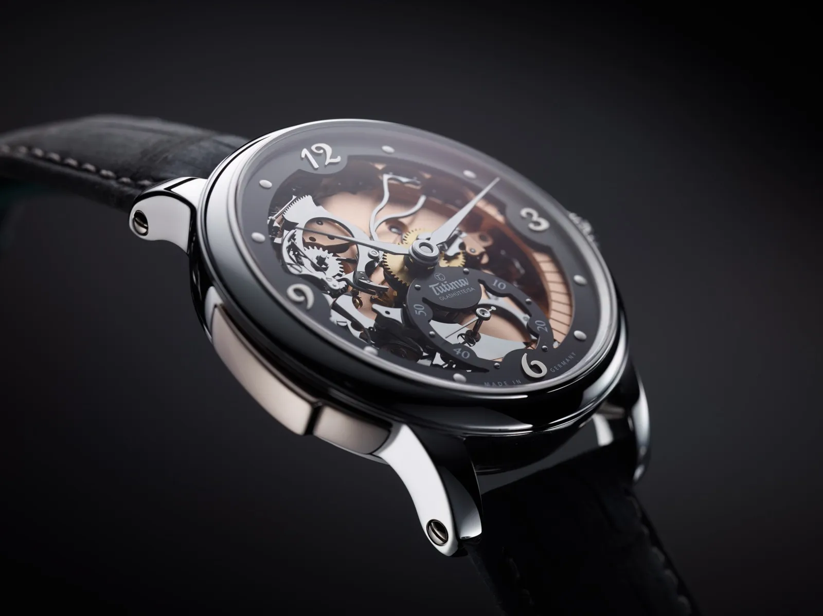 Hommage minute repeater — skeleton dial on dark background
